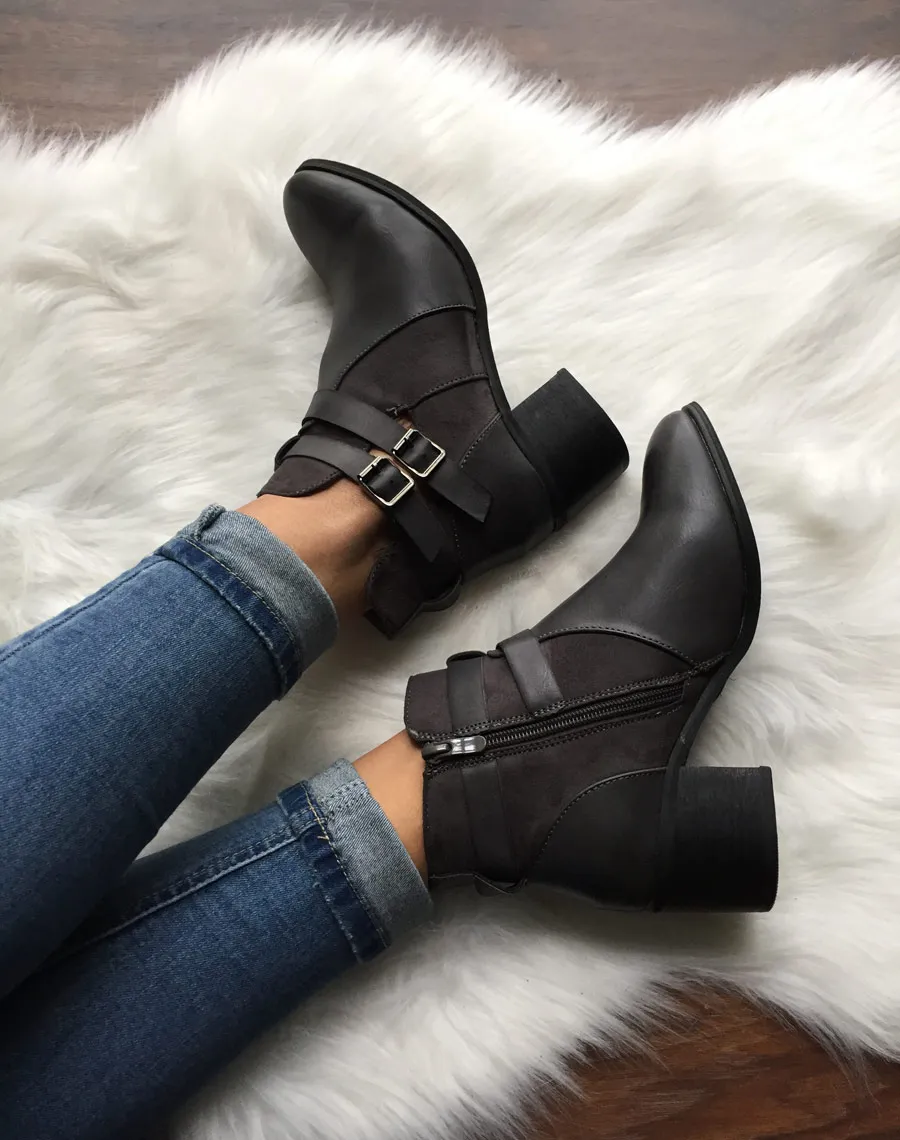 Gray cut-out ankle boots with medium heel.