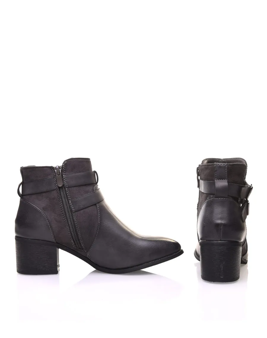 Gray cut-out ankle boots with medium heel.