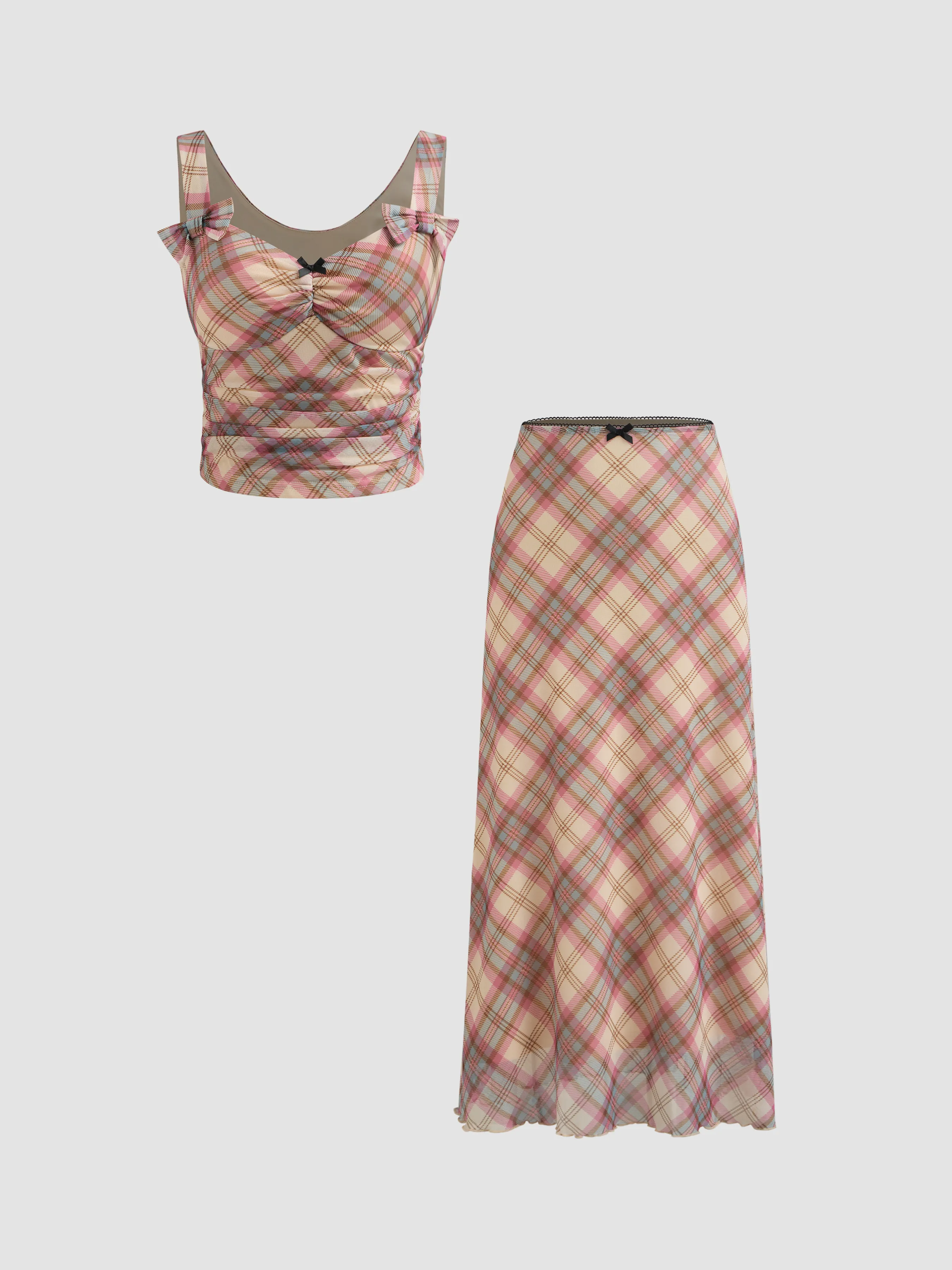 Plaid knit V-neck top with bow and high-waisted maxi skirt.