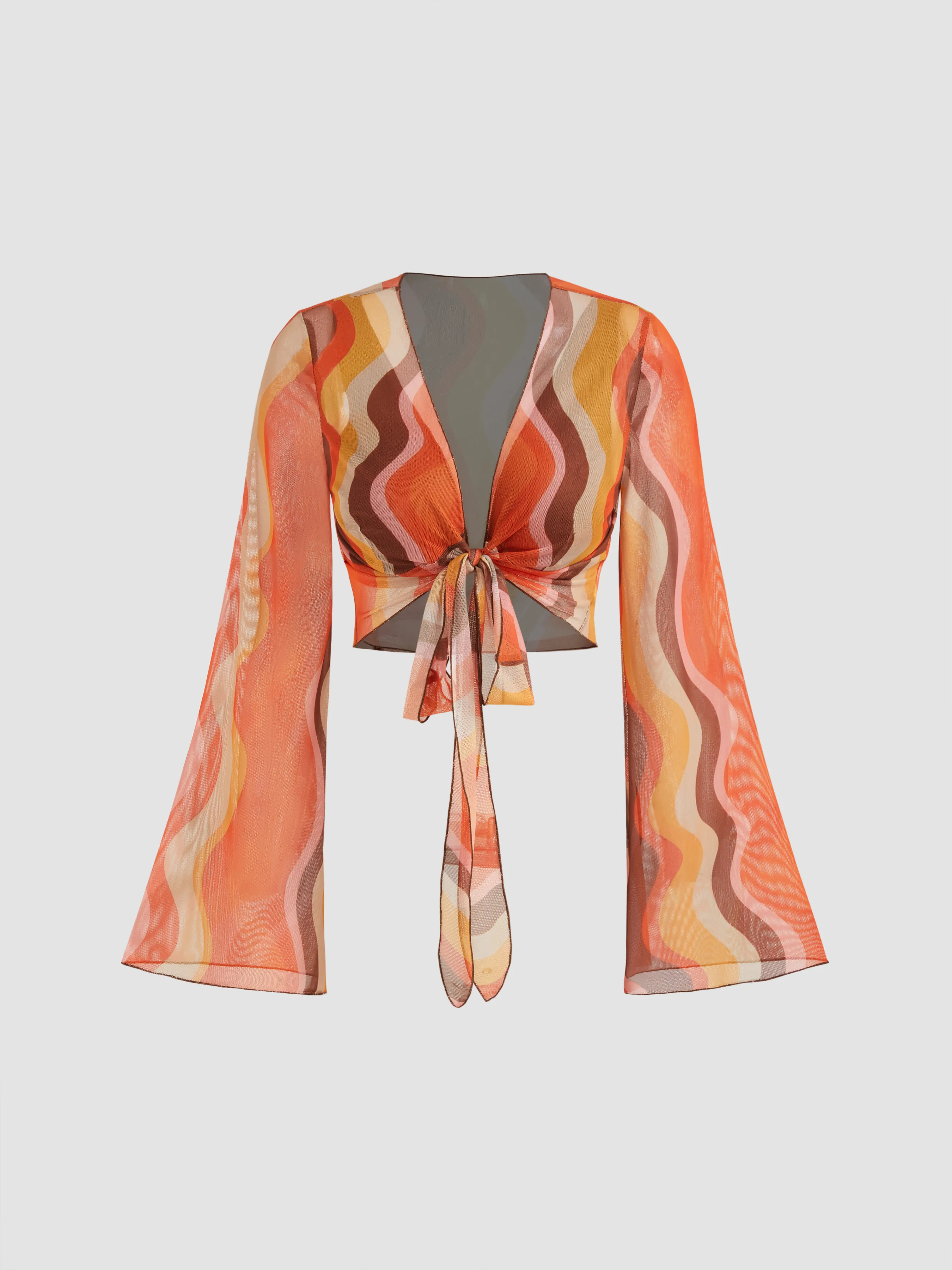 Short high-neck top with long sleeves and V-neck in abstract wave pattern knit.